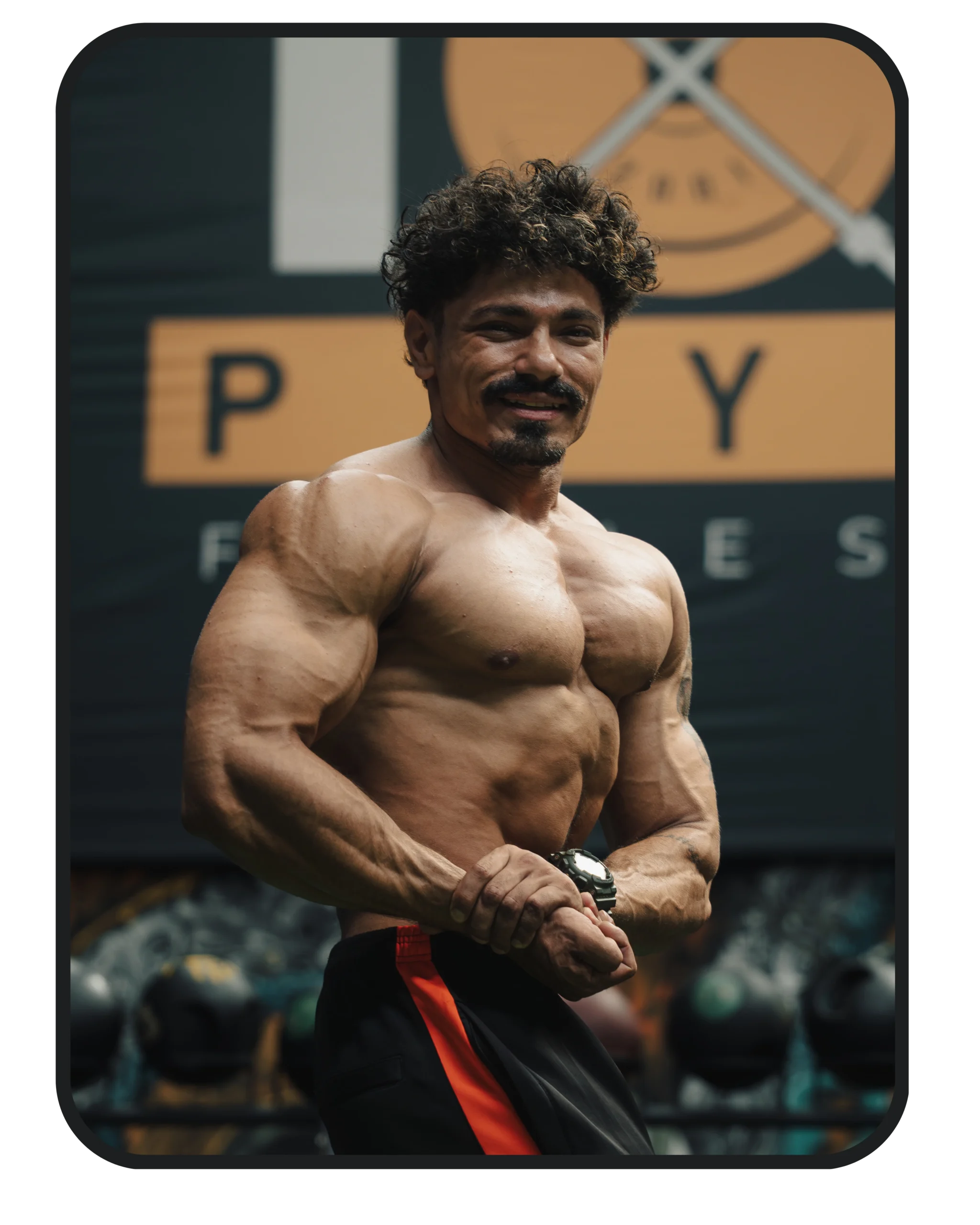 Male athlete showing physique in a modern gym at TPFC, one of the gym in Baneshwor.