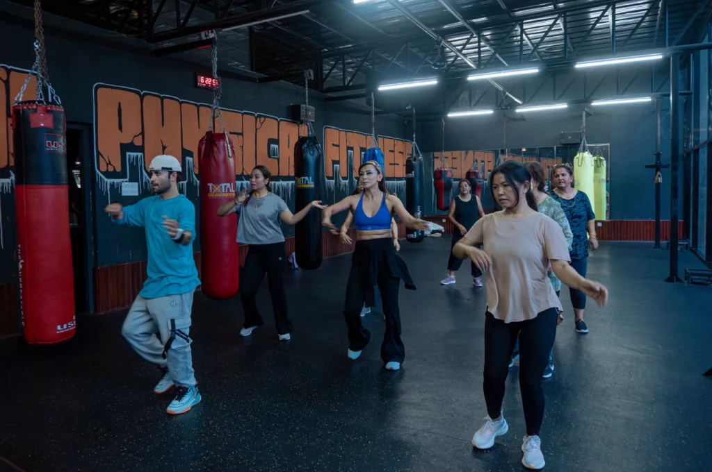 Group of adults dancing in a zumba class at Total Physical Fitness Center in Baneshwor, Kathmandu.